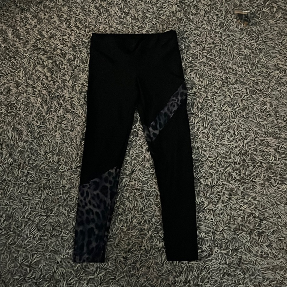 Black Koral shiny leggings with animal print detail.